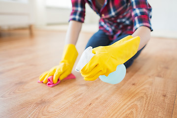 Image showing close up of woman with rag cleaning floor at home