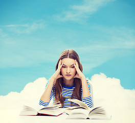 Image showing stressed student girl with books