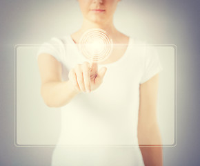 Image showing woman hand touching virtual screen