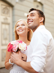 Image showing couple with flowers in the city