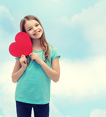 Image showing smiling little girl with red heart