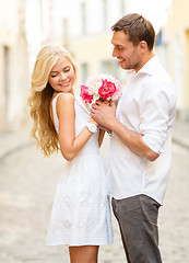 Image showing couple with flowers in the city