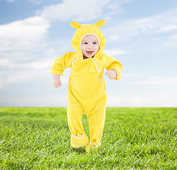 Image showing little happy baby making his first steps