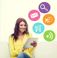 Image showing smiling woman with tablet pc computer at home