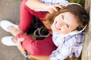 Image showing girl with headphones listening to music