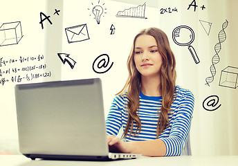 Image showing smiling teenage gitl with laptop computer at home