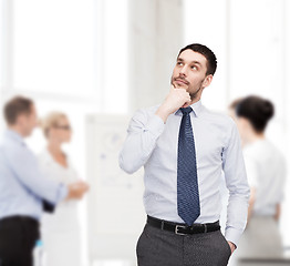 Image showing handsome businessman looking up