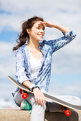 Image showing teenage girl with skate outside