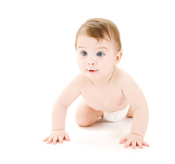 Image showing crawling curious baby