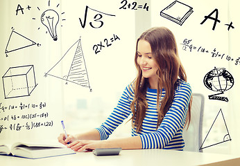 Image showing student girl with book, notebook and calculator