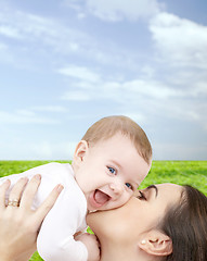 Image showing laughing baby playing with mother