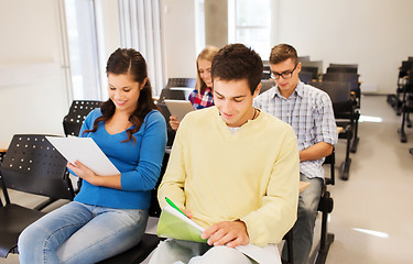 Image showing group of smiling students in lecture hall