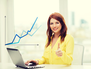 Image showing smiling student with laptop computer at school