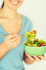 Image showing woman eating salad with vegetables