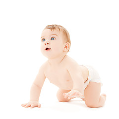 Image showing crawling curious baby