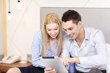 Image showing couple with tablet pc computer in hotel room