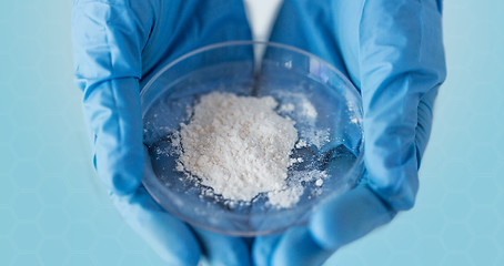 Image showing close up of scientist hands holding petri dish