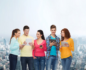 Image showing group of teenagers with smartphones and tablet pc