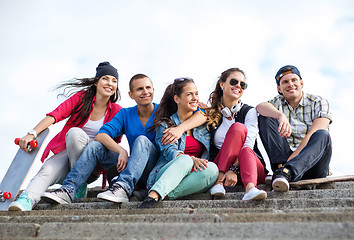 Image showing teenagers with skates outside