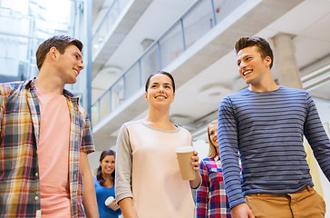 Image showing group of smiling students with paper coffee cups