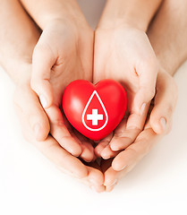 Image showing hands holding red heart with donor sign