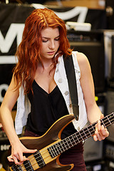 Image showing musician or customer with guitar at music store