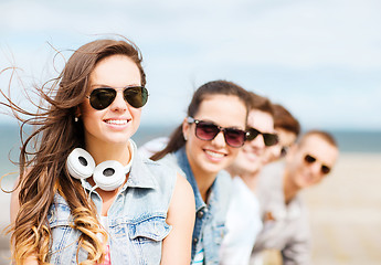 Image showing teenage girl with friends outside