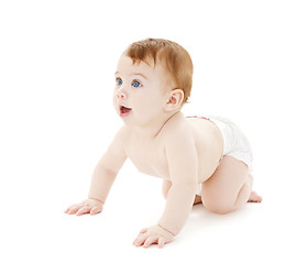 Image showing crawling curious baby