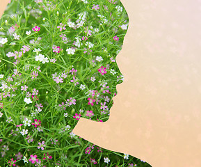 Image showing woman silhouette with green floral pattern