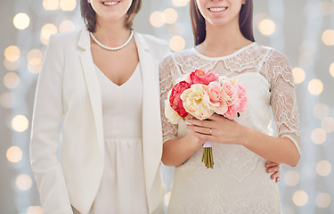 Image showing close up of happy lesbian couple with flowers