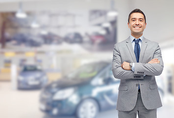 Image showing happy man at auto show or car salon