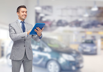 Image showing happy businessman in suit with tablet pc