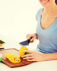 Image showing woman cutting vegetables