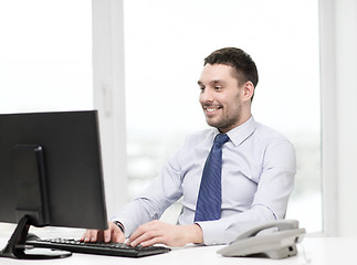 Image showing smiling businessman or student with computer