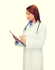 Image showing smiling female doctor with clipboard