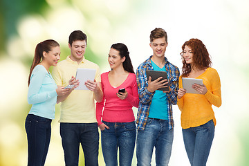 Image showing group of teenagers with smartphones and tablet pc