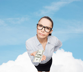 Image showing smiling businesswoman with dollar cash money