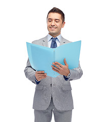 Image showing happy businessman with open folder