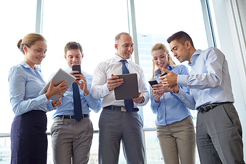 Image showing business people with tablet pc and smartphones