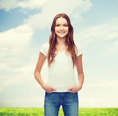 Image showing smiling teenager in blank white t-shirt