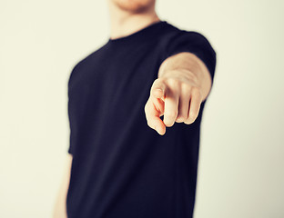 Image showing man pointing his finger at you