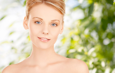 Image showing beautiful young woman face over green background