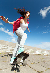 Image showing teenage girl skating outside