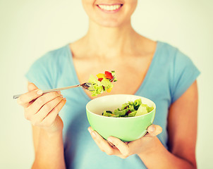 Image showing woman eating salad with vegetables