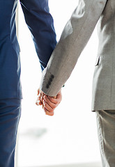 Image showing close up of male gay couple holding hands