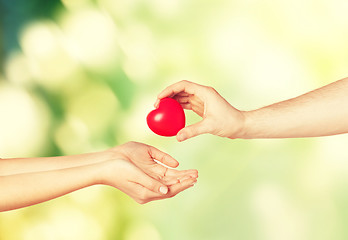 Image showing woman and man hands with heart