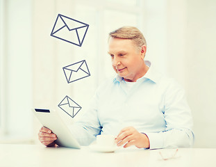 Image showing old man with tablet pc computer at home