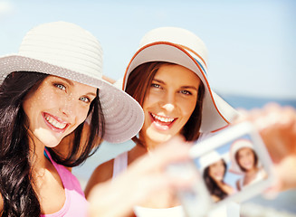 Image showing girls taking self portrait on the beach