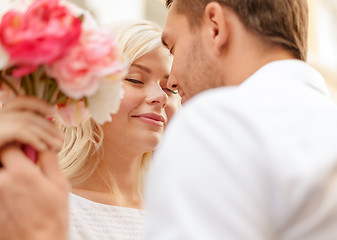 Image showing couple with flowers in the city