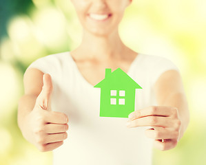 Image showing woman hands holding green house